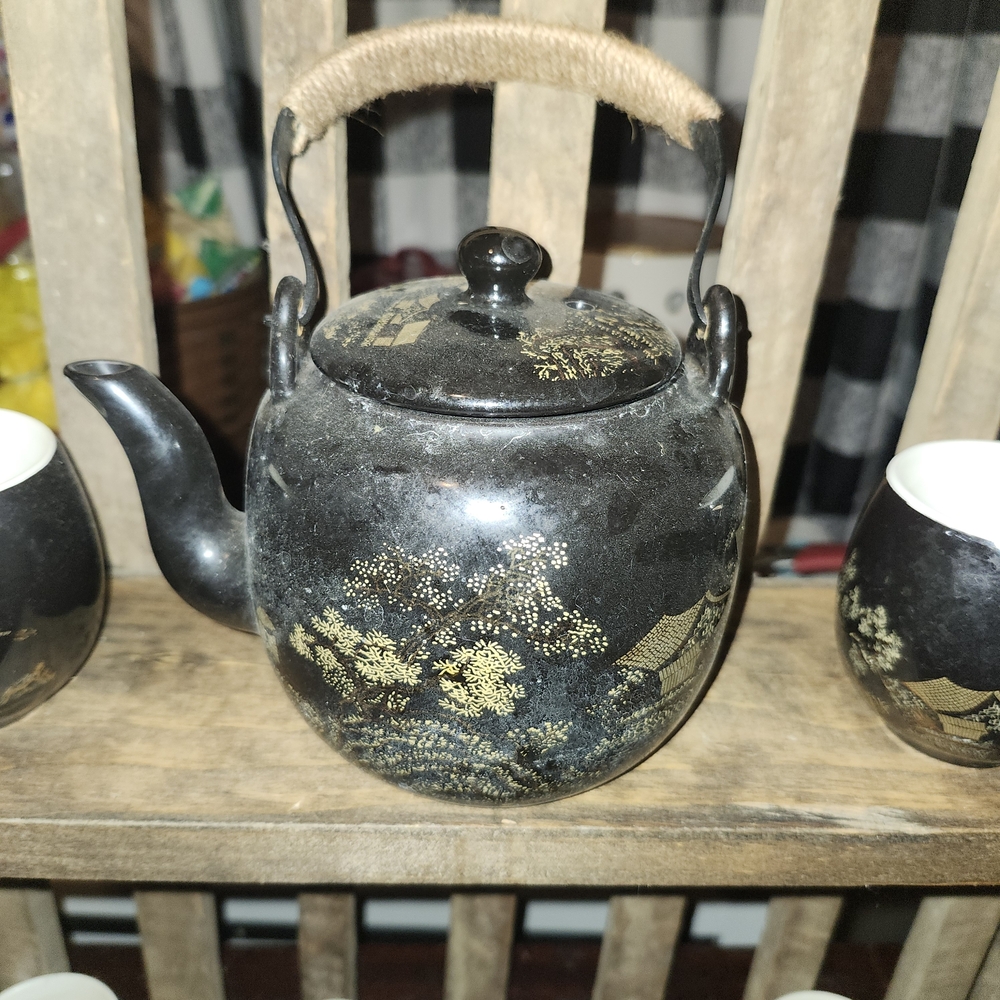 Elegant Black Teapot with Gold Accents